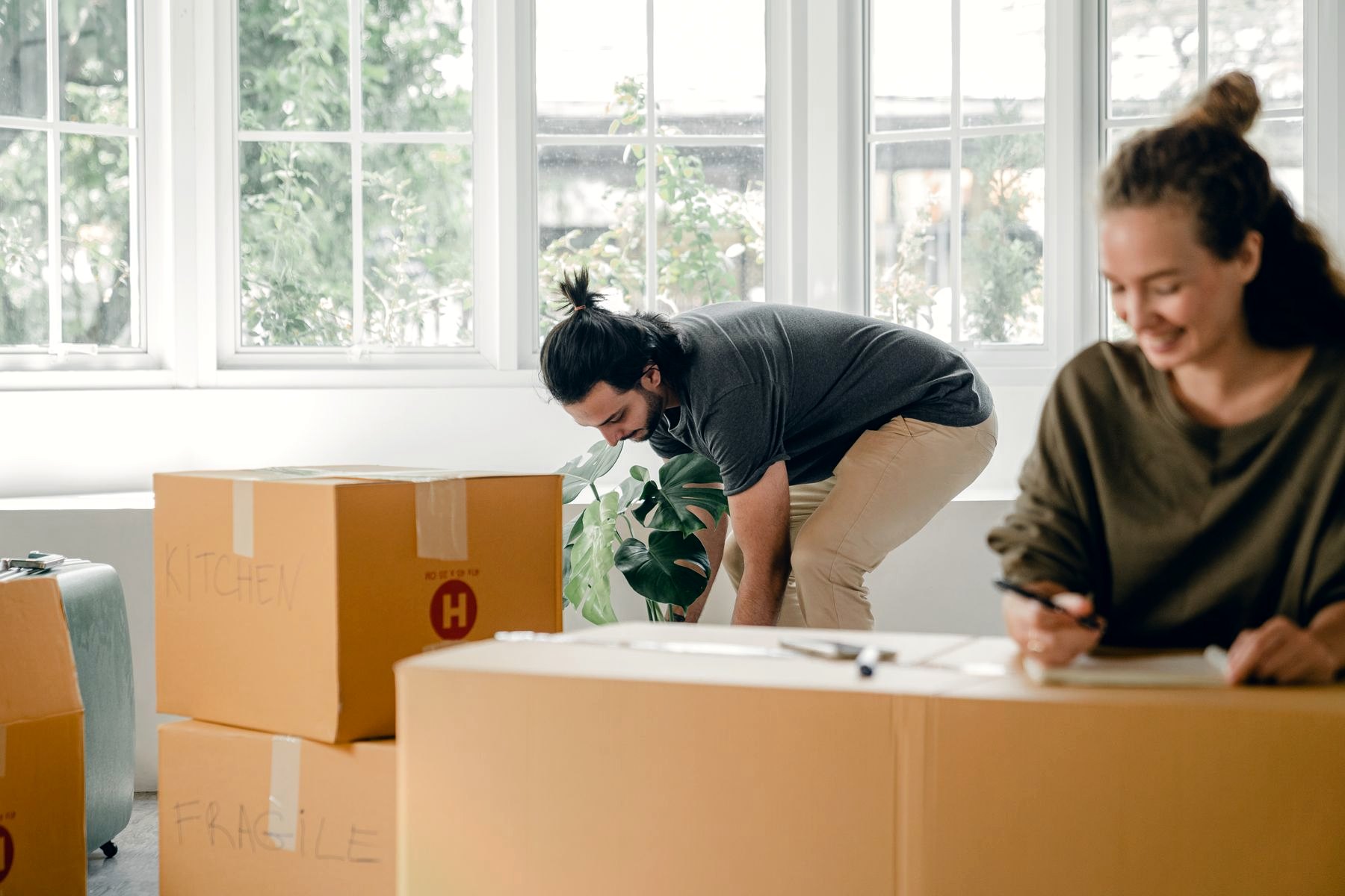 A couple settling into their new apartment